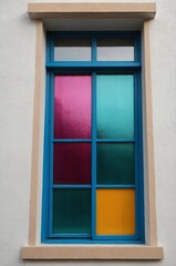 Obraz premium Portrait of colorful window on white wall background 