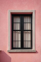 Fototapeta premium Portrait of black window on pink wall background 