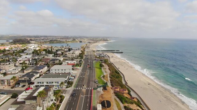 Aerial Forward Push Over Carlsbad Boulevard Coastal Infrastructure and Beach