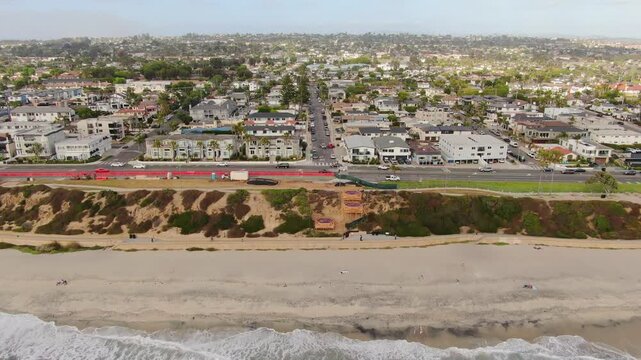 Aerial Ascent View East Over Carlsbad Boulevard and Coastal Neighborhood
