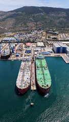 Fototapeta premium Aerial drone photo of famous Skaramangas Shipyards, an emblematic infrastructure in gulf of Elefsina, West Attica, Greece