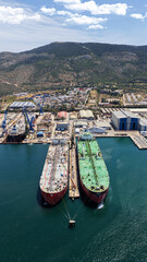 Fototapeta premium Aerial drone photo of famous Skaramangas Shipyards, an emblematic infrastructure in gulf of Elefsina, West Attica, Greece