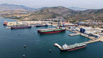 Obraz premium Aerial drone photo of famous Skaramangas Shipyards, an emblematic infrastructure in gulf of Elefsina, West Attica, Greece