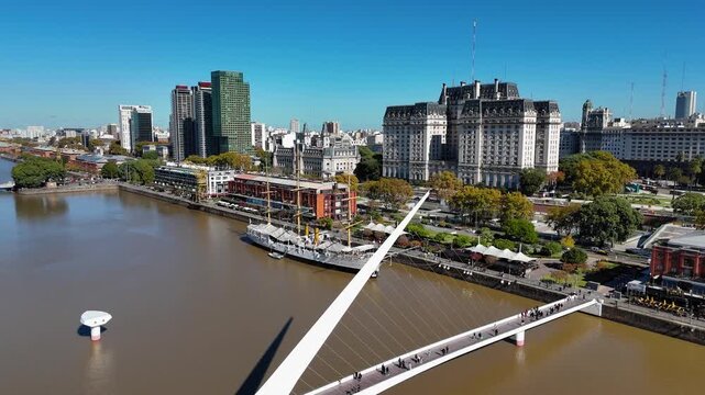 People crossing Puente de la Mujer bridge in Buenos Aires