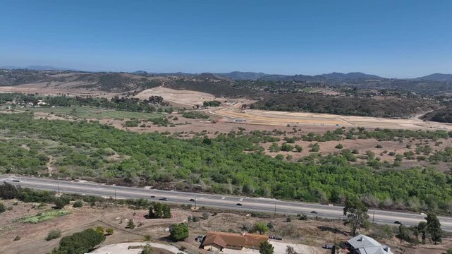 Aerial view of Fallbrook, Rainbow Crest, Rainbow Ridge with big mansion and green valley, San Diego County California