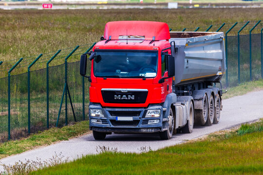 MAN TGS with empty Wielton tipper trailer on dirt road on May 8, 2025 in Bratislava, Slovakia