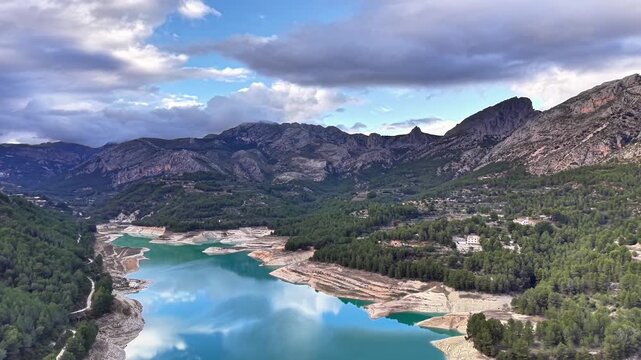Aerial Mountain Lake Reflecting Dramatic Golden Light, Landscape Artist Scouting Composition From Drone