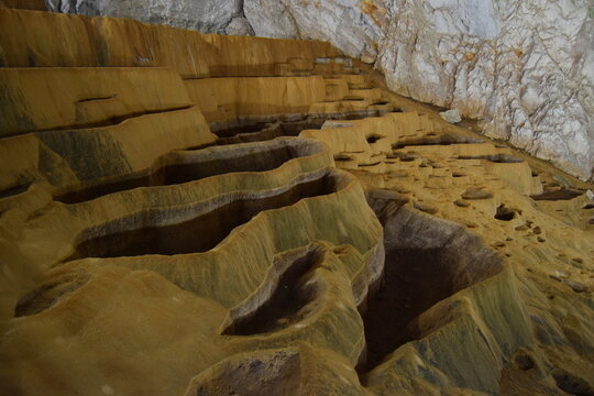 Unique limestone terrace pools inside Stopica Cave