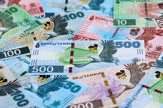 Zambian kwacha money banknotes pile on table. Zambia bills of ZMW currency close up