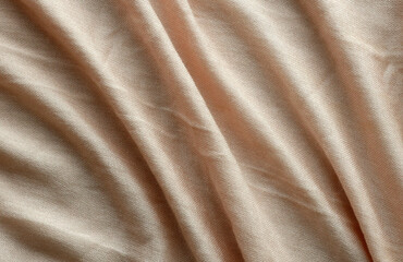 Fototapeta premium Orange scarf fabric texture surface. Peach color cloth material for backdrops