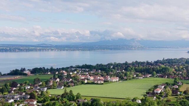 Serene Drone Flight Over Lake Geneva Charming Swiss Villages and Green Valleys in French Switzerland, Breathtaking Aerial Views of Lake Leman Picturesque Towns and Snow Capped Alps Switzerland