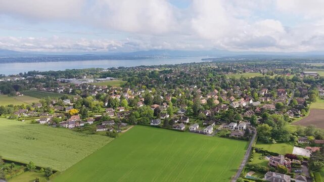 Serene Drone Flight Over Lake Geneva Charming Swiss Villages and Green Valleys in French Switzerland, Breathtaking Aerial Views of Lake Leman Picturesque Towns and Snow Capped Alps Switzerland