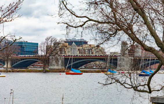 A commuter train rumbles on the Longfellow bridge over the Charles River near downtown Boston, Mass. The steel-rib arch bridge connects the city with Cambridge, Mass.