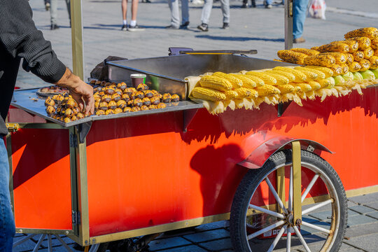A Turkish street food vendor sells roasted chestnuts, or kestane, and roasted and boiled corn on the cob misir, in Istanbul, Turkey.