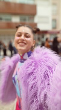 Whimsical performer twirling amid lively crowd and sparkling lights