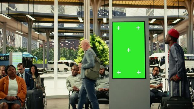 Chroma key screen in busy bus station with diverse people using convenient bus connections and mass transit services across the metropolitan area. Commercial route at rush hour.