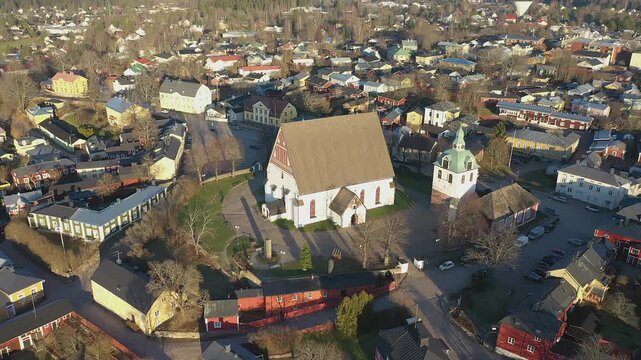 Porvoo.Finland-December 12.2020: Pretty drone point of view of the Evangelical Lutheran Church in Porvoo Finland on a sunny day during autumn. Camera slowly turning around the church.