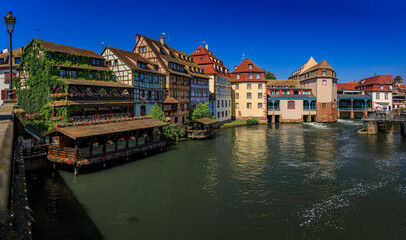 Obraz premium Half timbered houses with flowers, canals of Petite France in Strasbourg, France