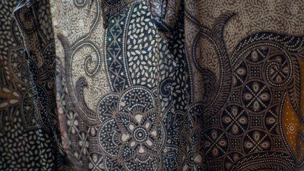 Close-up of traditional patterned fabric displaying intricate designs and textile artistry