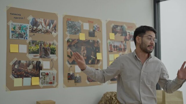 Man office team meeting brainstorming project presentation planning idea collaboration on white wall sticky note board creative process business strategy room work design SEO title for video upload