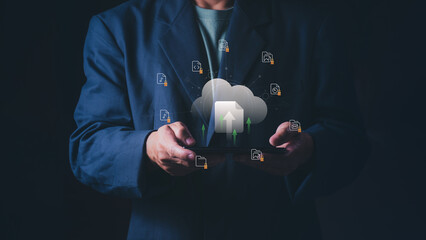 Businessman uploading digital files to cloud storage via smartphone, Concept of cloud computing technology, data backup, online document management, information security, and network database. © 418 House