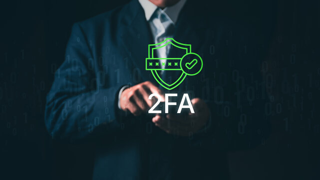 Businessman using smartphone for two-factor authentication (2FA), Concept of cybersecurity, identity verification, privacy protection, secure login, digital data safety, and fraud prevention.