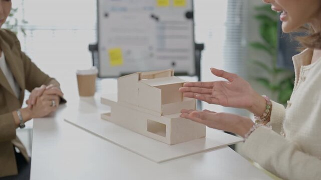 Architectural Model Design Meeting in Modern Office Workspace, Building Planning Discussion, Interior Project Review and Collaborative Team Presentation