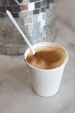 Traditional Turkish salep Drink in paper cup with cinnamon topping