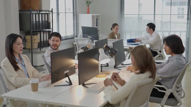Modern office meeting business team collaboration in workspace with computer desk, coworker discussion, open plan workplace and bright professional interior for SEO friendly search title