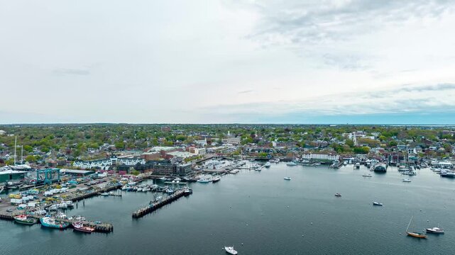 Newport historic downtown aerial hyperlapse, a drone flight along the coastal harborfront, docks, and sailboat marinas in Newport, Rhode Island.