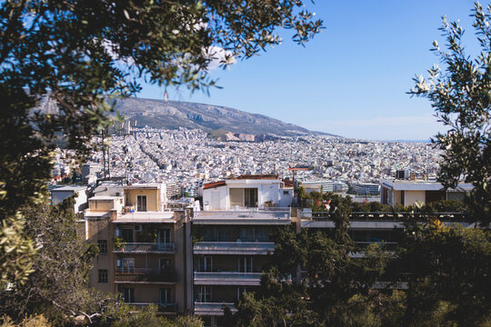 Athens, Attica, Greece, beautiful panoramic view of Athens cityscape, with The Parthenon, mountains, sea and scenery beyond the city, seen from Mount Lycabettus Hill observation deck in a sunny day