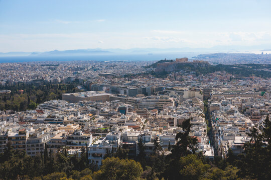 Athens, Attica, Greece, beautiful panoramic view of Athens cityscape, with The Parthenon, mountains, sea and scenery beyond the city, seen from Mount Lycabettus Hill observation deck in a sunny day