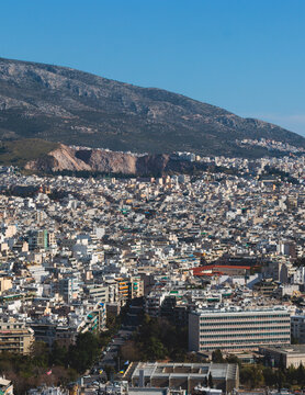 Athens, Attica, Greece, beautiful panoramic view of Athens cityscape, with The Parthenon, mountains, sea and scenery beyond the city, seen from Mount Lycabettus Hill observation deck in a sunny day