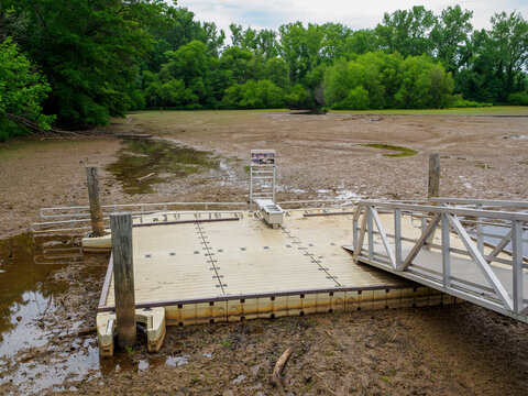 This image taken by the Catawba river near Kevin Lofting Riverfront park shows a floating Boat Dock Stranded on Mud During Severe  Drought currently affecting North Carolina.