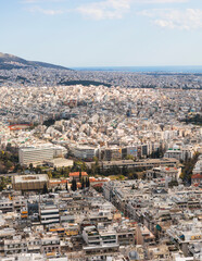 Obraz premium Athens, Attica, Greece, beautiful panoramic view of Athens cityscape, with The Parthenon, mountains, sea and scenery beyond the city, seen from Mount Lycabettus Hill observation deck in a sunny day