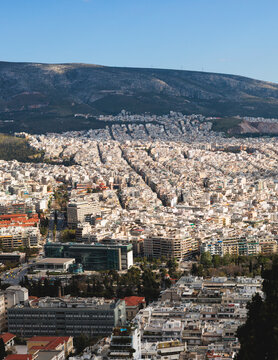 Athens, Attica, Greece, beautiful panoramic view of Athens cityscape, with The Parthenon, mountains, sea and scenery beyond the city, seen from Mount Lycabettus Hill observation deck in a sunny day