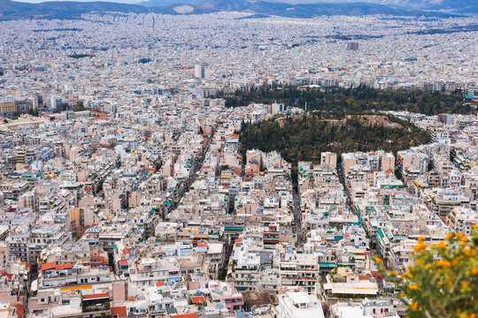 Athens, Attica, Greece, beautiful panoramic view of Athens cityscape, with The Parthenon, mountains, sea and scenery beyond the city, seen from Mount Lycabettus Hill observation deck in a sunny day