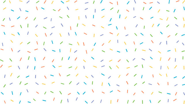 A dynamic mix of rainbow colored confectionery sprinkles scattered randomly across a bright white surface