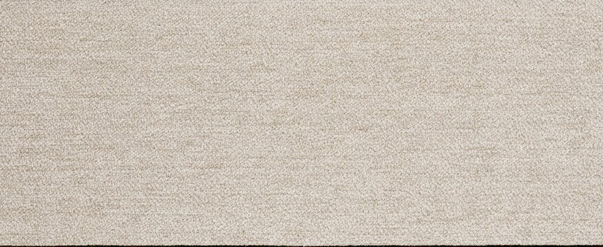 A close-up view of a textured beige carpet surface