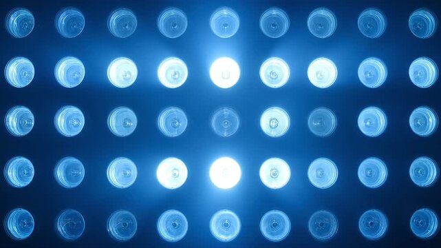 Animated blue LED lights pattern glowing in sequence on dark background.
