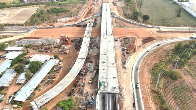 Aerial view drone footage of construction site building cross intersection bridge