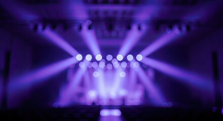 Vibrant Purple Stage Lights Illuminating a Dark Concert Venue.