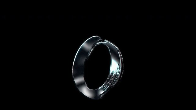 Silver metallic brush-stroke lowercase "o". Alpha channel. Seamless loop video