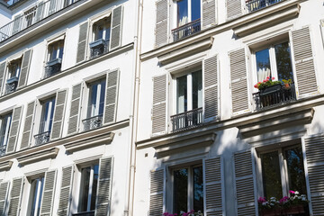Fototapeta premium Paris, typical facade and windows, beautiful building rue de Babylone, detail of the facade 