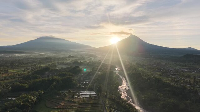 Aerial Drone View of Mount Merapi and Mount Merbabu at Sunrise in Central Java Indonesia