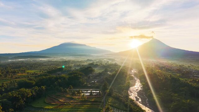 Aerial Drone View of Mount Merapi and Mount Merbabu at Sunrise in Central Java Indonesia