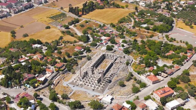 Didim, Turkey. Temple of Apollo at Didyma, colossal decastyle Ionic colonnade and symmetrical hypaethral sanctuary, aerial drone view under bright summer sun. Aerial View, MasterShots, Spiral forward