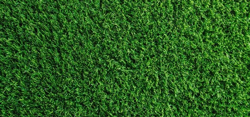 Obraz premium Green artificial turf texture providing vibrant background