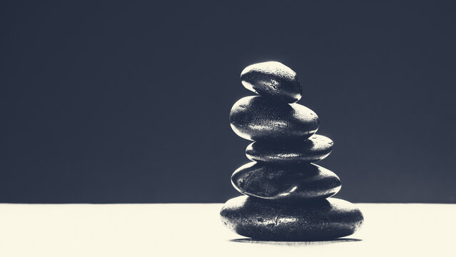 Minimalist monochrome stack of zen stones with vintage sepia toning and copy space