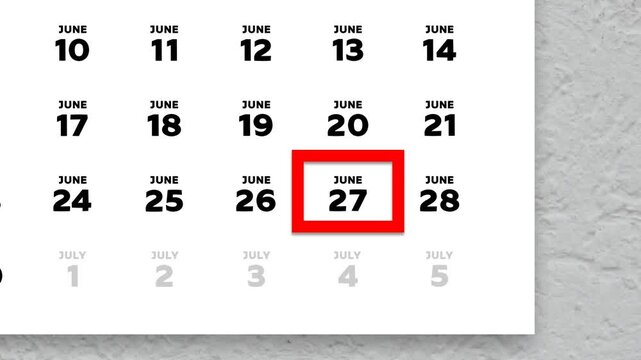 The date June 27th marked with a red cursor on the wall calendar 2026